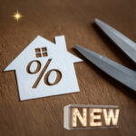 New mortgage rate changes symbolised by house cutout, percentage sign and scissors