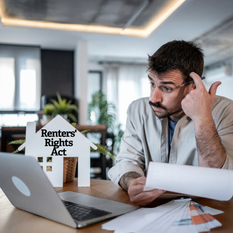 Landlord reviewing documents about the Renters’ Rights Act at his desk