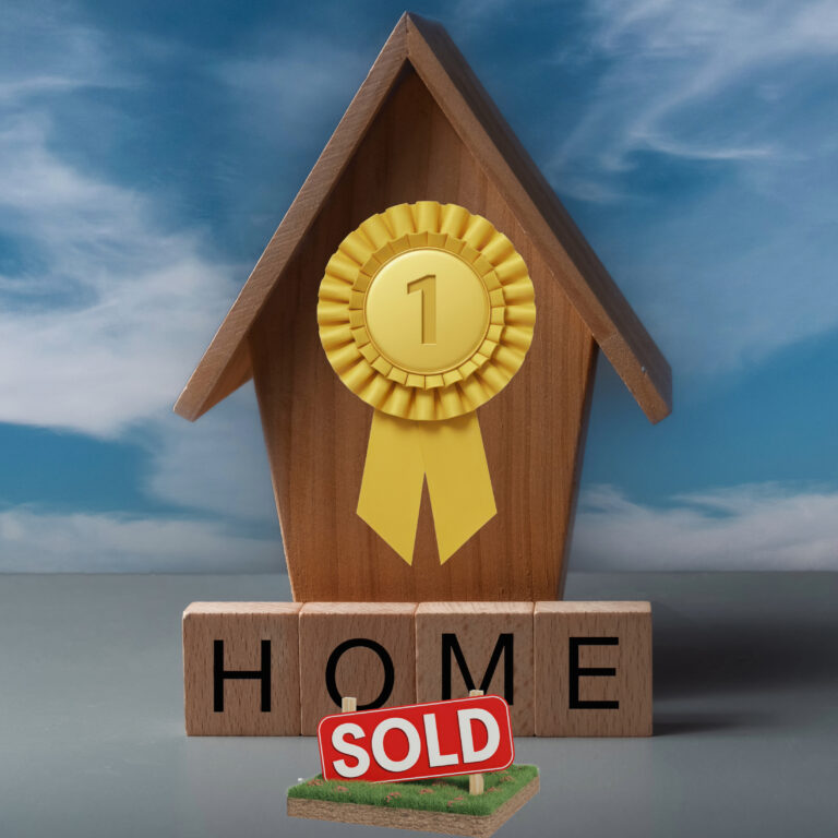 Award ribbon on a wooden house with a sold sign highlighting first-time buyer market trends.