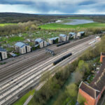 New housing beside railway lines demonstrating plans for development near well-connected train stations