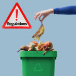 Food waste being placed into a green recycling bin alongside a warning sign about new waste regulations for HMO landlords