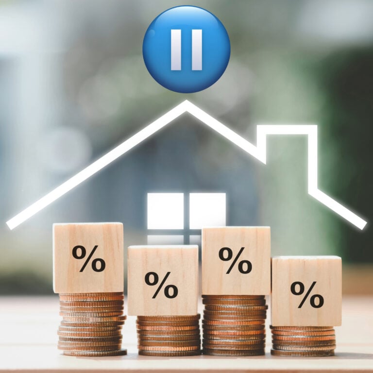 House price trend illustration showing paused market with interest rate symbol and stacked coins