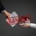 Cash being exchanged for a house to illustrate debates over rent-in-advance rules