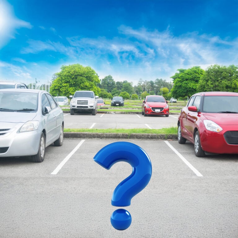 Question mark over empty parking bay highlighting uncertainty over allocated parking space