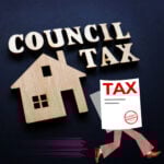 Council tax concept with wooden house icon and tax bill illustration relating to political story on council tax surcharge.
