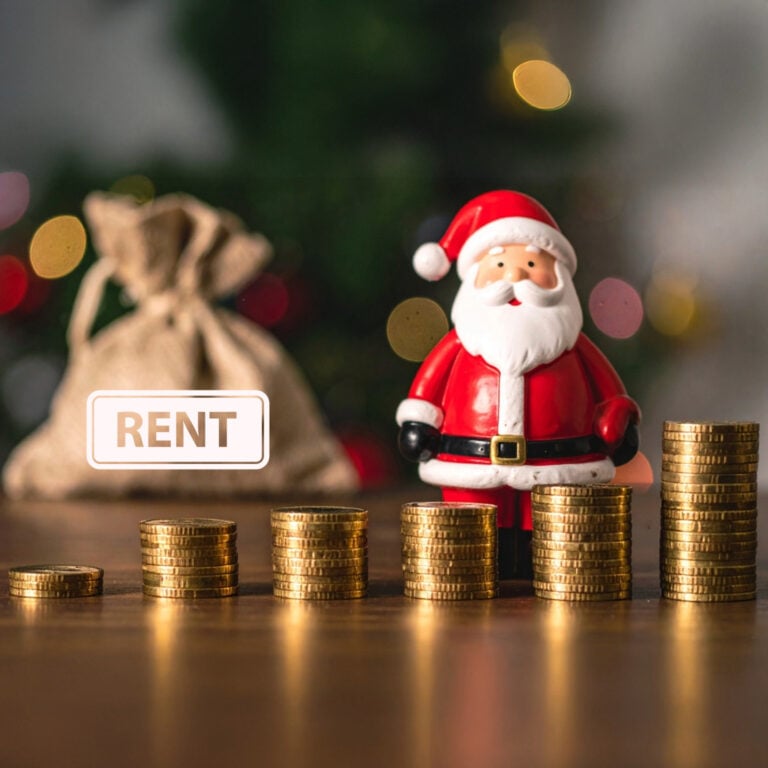 Santa figurine beside stacked coins symbolising rising pre-Christmas rent pressures