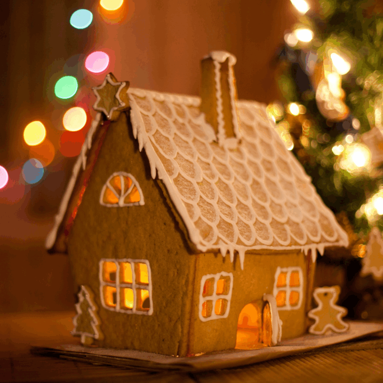 Gingerbread house glowing warmly beside Christmas lights, symbolizing selling with Landlord Sales Agency before tax rises.