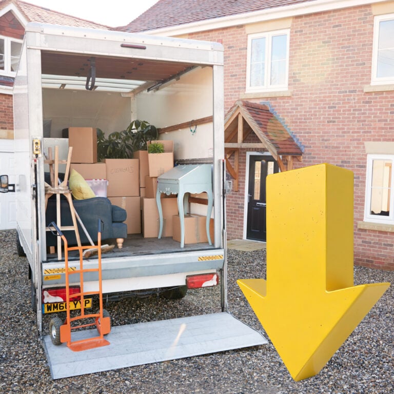 Removal van loaded with boxes and furniture outside a rented home, illustrating tenant moves and eviction trends