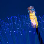 Ethernet cable emerging from fibre optic strands, representing gigabit broadband access for flats