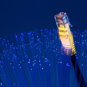 Ethernet cable emerging from fibre optic strands, representing gigabit broadband access for flats