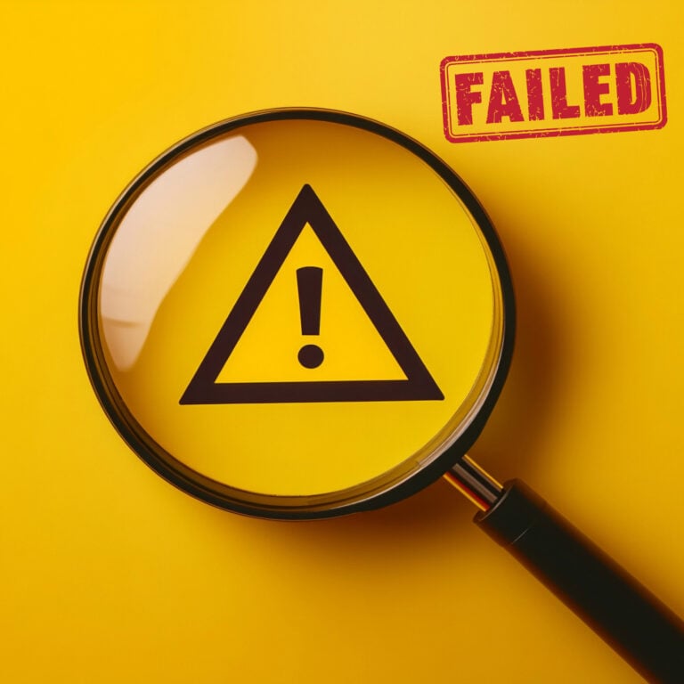 Warning symbol under a magnifying glass with a failed stamp, representing regulatory failings in social housing safety