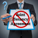 Landlord holding a clipboard showing “Joint Tenancy Agreement” crossed out, highlighting tenancy status concerns
