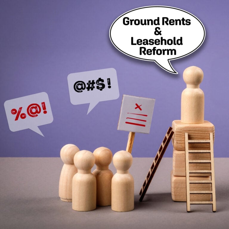 Wooden figures illustrating conflict over ground rents and leasehold reform
