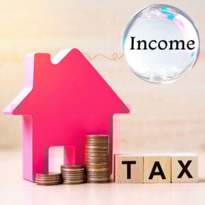 House silhouette with stacked coins and tax blocks symbolising higher property income taxes and pressure on landlords