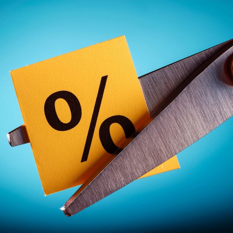 Percentage symbol being cut, representing rising rental deposits and upfront moving costs