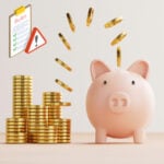 Piggy bank beside stacked coins illustrating tenant deposit protection rules under new rental guidance.