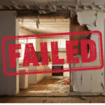 Failed inspection stamp over a damaged social housing kitchen with signs of damp, decay and disrepair.