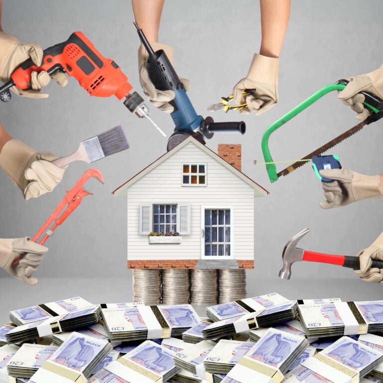 House on stacks of coins surrounded by tools, symbolising the cost of property upgrades under new housing standards