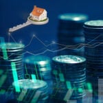 House on a key above stacked coins and financial charts representing buy to let borrowing trends