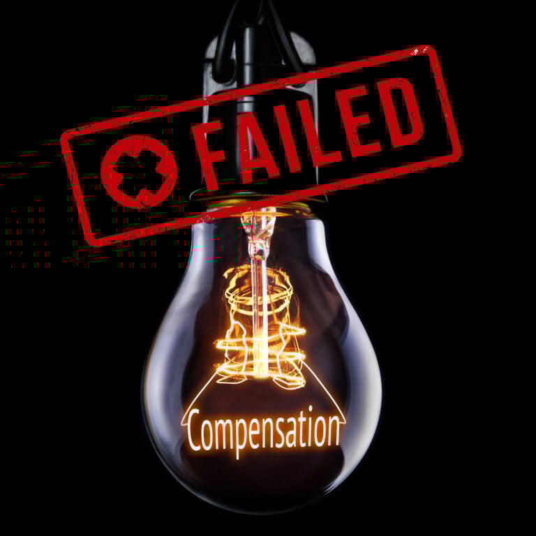 Light bulb with red FAILED stamp and the word compensation glowing inside, symbolising failure to deliver fair redress