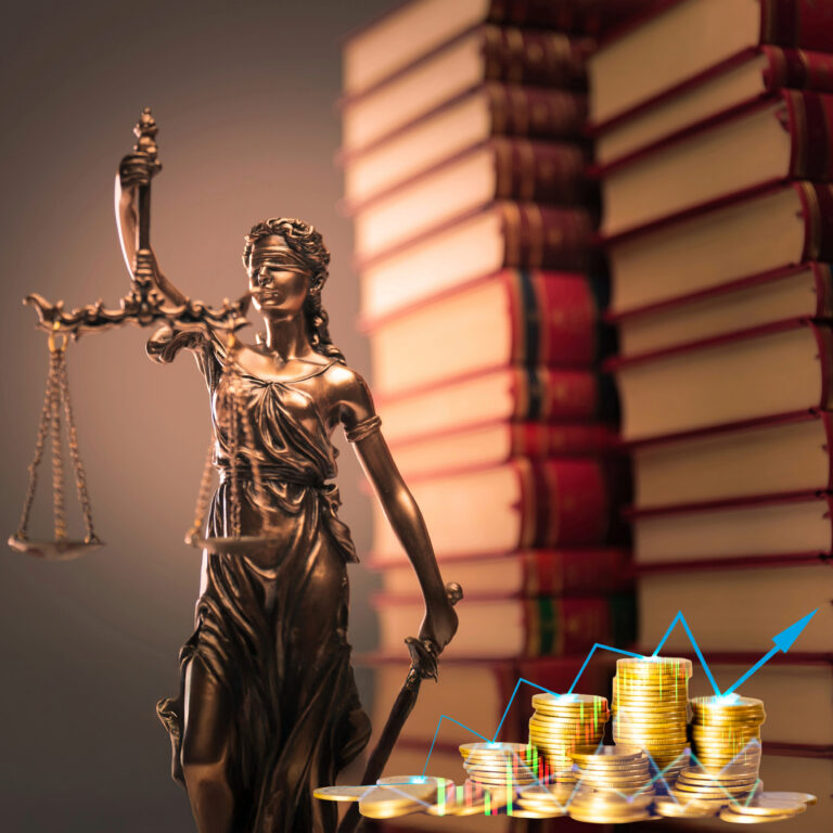 Lady Justice statue with scales and stacked law books, symbolising court backlogs and housing disputes