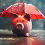 Piggy bank under a red umbrella in the rain, symbolising tenancy deposit protection