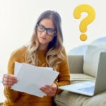 Landlord reviewing tenant documents with laptop, questioning referencing checks under new Renters’ Rights Act