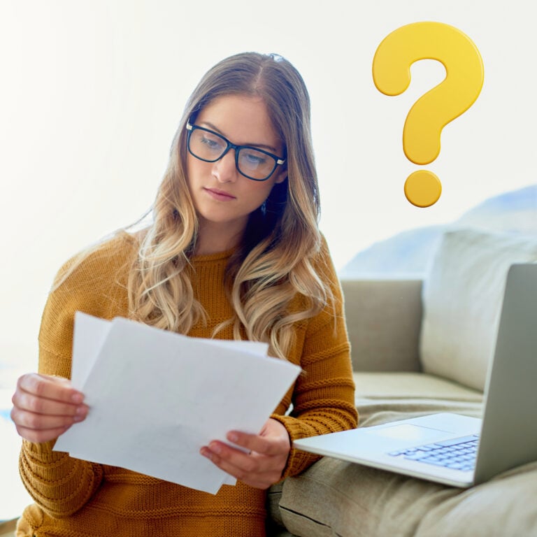 Landlord reviewing tenant documents with laptop, questioning referencing checks under new Renters’ Rights Act