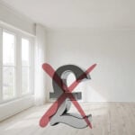 Crossed-out pound symbol in an empty room representing limits of financial penalties on vacant homes