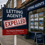 Letting agent sign marked “Expelled” outside a high street office, illustrating firms removed from a redress scheme over unpaid compensation awards.
