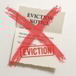 Eviction notice document crossed out with red X symbolising end of no-fault evictions