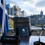 Empty cabinet chair with housing policy folder at the Scottish Parliament in Edinburgh
