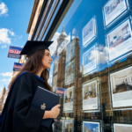 Graduate reviewing rental property listings in a city as rising rents challenge affordable housing options.