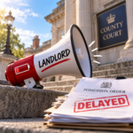 Megaphone marked “Landlord” beside a delayed possession order outside a county court